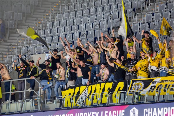 Ice hockey fans of the Rouen Dragons France celebrate a goal of their team in the SAP Arena