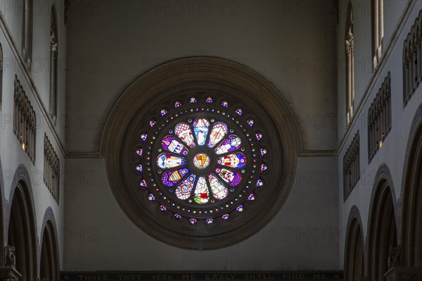 Interior Wilton Italianate church, Wiltshire, England, UK round stained glass window above entrance