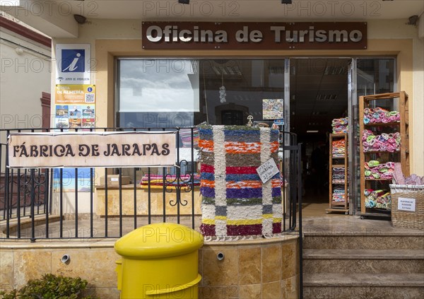 Textile products on display Oficina de Turismo tourist information shop and office, village of Nijar, Almeria, Spain, Europe