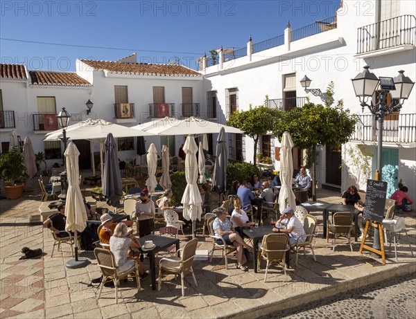 People and cafes in church square plaza, Plaza de la Iglesia, Frigiliana, Axarquia, Andalusia, Spain, Europe