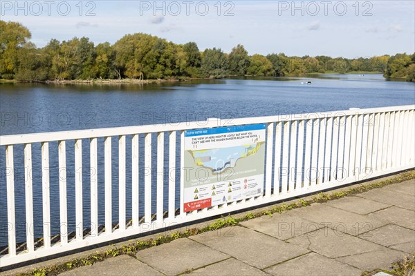 Alton Water reservoir lake, Tattingstone, Suffolk, England, UK notice warning of hidden submerged dangers
