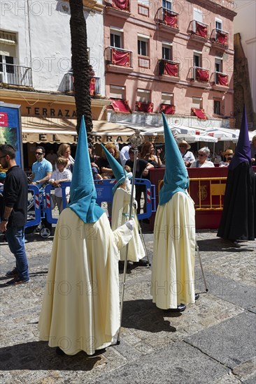 Semana Santa, procession with Nazarenos and tourists, celebrations in Cadiz, Spain, Europe