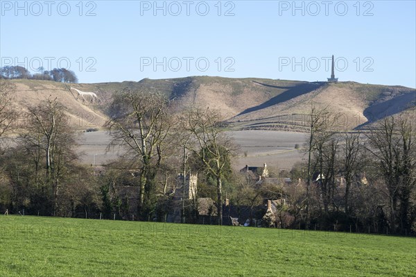 White horse, Lansdowne monument, Oldbury Camp hill fort, chalk scarp slope, Cherhill village, Wiltshire, England, UK