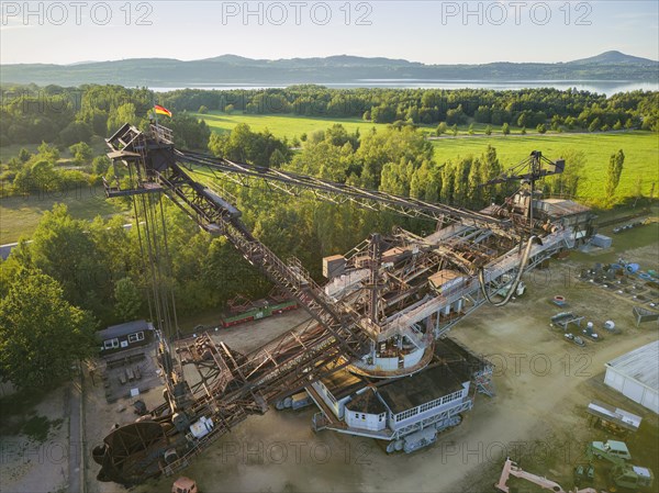 The excavator 1452 with the type designation SRs 1200 is a bucket wheel excavator that was manufactured in 1961 by VEB Schwermaschinenbau Lauchhammerwerk for lignite mining and was in use until 2001. After being decommissioned, the bucket-wheel excavator remained in the former Berzdorf open-cast mine near Goerlitz (now Lake Berzdorf) and has since been preserved as a museum by the Berzdorf - Oberlausitz Mining Witness Association. Due to its significance in terms of local and technical history, it has also been included in the