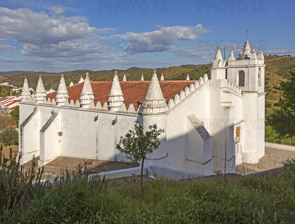 Architectural details of conical roof decorations historic whitewashed church Igreja Matrix in medieval village of Mertola, Baixo Alentejo, Portugal, Southern Europe, Europe