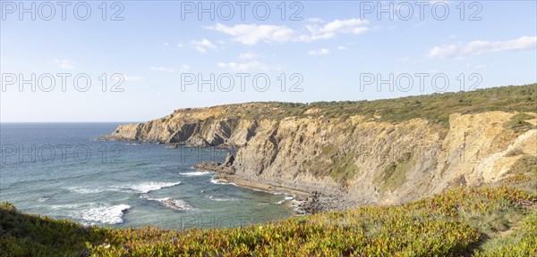 Rocky coastal landscape Praia dos Alteirinhos beach in bay with rocky headland part of Parque Natural do Sudoeste Alentejano e Costa Vicentina, Costa Vicentina and south west Alentejo natural park, Zambujeira do Mar, Alentejo Littoral, Portugal, southern Europe, Europe