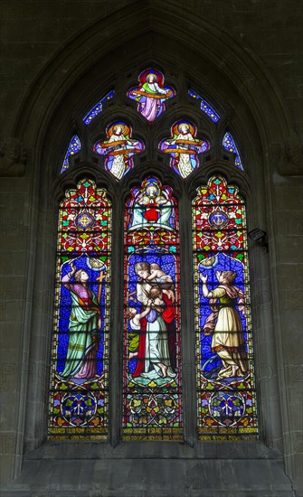 Stained glass window Faith, Hope, Charity priory church at Edington, Wiltshire, England, UK 1866 by Baillie