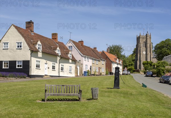 Pretty historic cottages and church in village of Monks Eleigh, Suffolk, England, UK