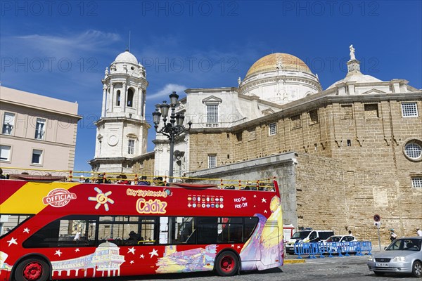 Red double-decker bus with tourists in front of the cathedral of Cadiz, Cathedral of the Holy Cross above the sea, Sightseeing, Cadiz, Andalusia, Spain, Europe