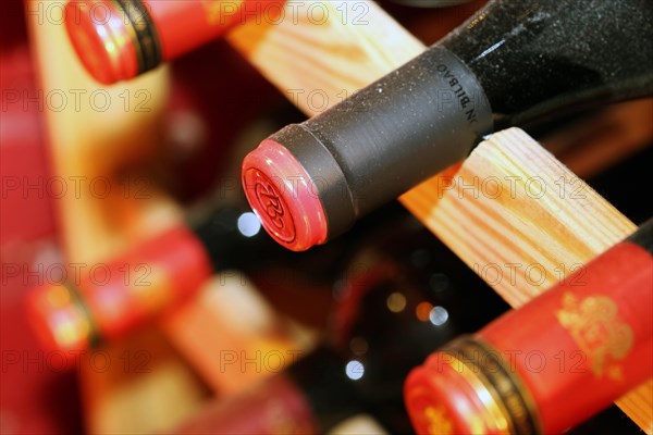 Wine cellar with red wine bottles (editorial)