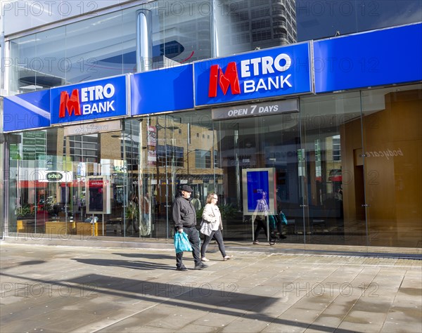 Signs on Metro Bank building, Regent Street, Swindon, Wiltshire, England, UK