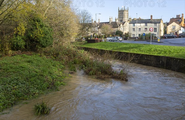 River Marden high water level after winter rain, Calne town centre, Wiltshire, England, UK