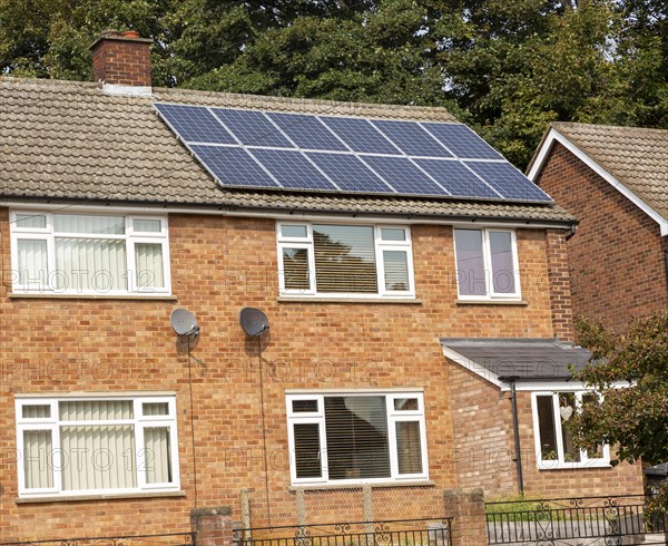 Solar panels of roof of semi-detached modern house in Ipswich, Suffolk, England, UK