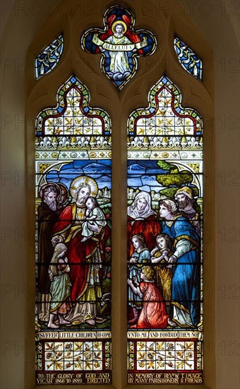 Stained glass window 'Suffer the Little Children' c 1889, Wickham Market church, Suffolk, England, UK by Ward and Hughes