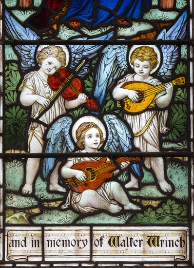 Detail of stained glass window three angels playing music by Powell and Son c 1915, Erwarton church, Suffolk, England, UK