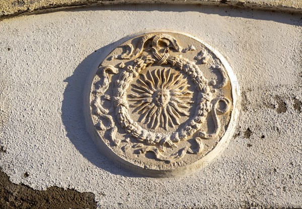 Stone or plasterwork image of the sub set in a wall, Mijas pueblo, Malaga province, Andalusia, Spain, Europe