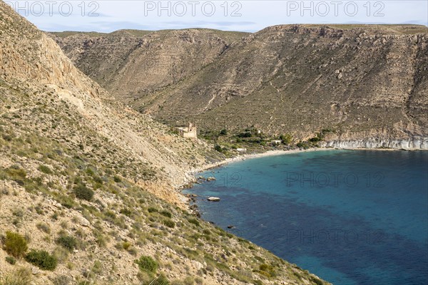 Castle, buildings and beach Cala de San Pedro, Cabo de Gata Natural Park, Nijar, Almeria, Spain, Europe