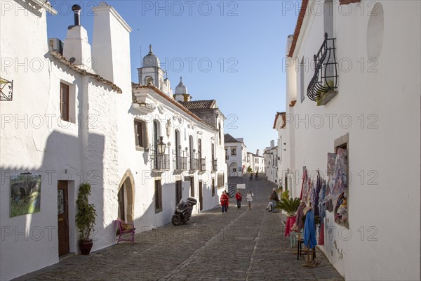 Historic cobbled street whitewashed buildings walled hilltop village of Monsaraz, Alto Alentejo, Portugal, southern Europe, Europe