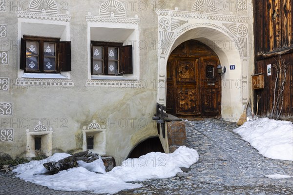 House entrance door, window, historic house, sgraffito, facade decorations, Guarda, Engadin, Grisons, Switzerland, Europe