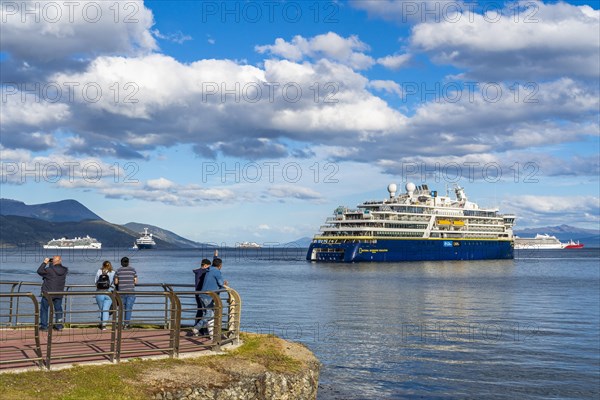 People watching cruise ships in the harbour at the Beagle Channel, Ushuaia, Tierra del Fuego Island, Patagonia, Argentina, South America