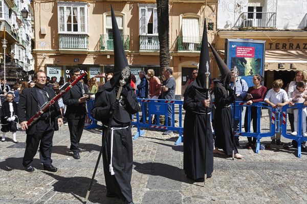 Semana Santa, procession with Nazarenos and tourists, celebrations in Cadiz, Spain, Europe