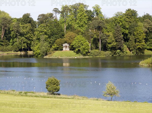 Doric temple and lake, Bowood House and gardens, Calne, Wiltshire, England, UK