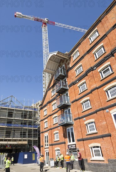 Tall crane at construction site of the 'Wine Rack' building, Waterfont, Wet Dock, Ipswich, Suffolk, England, UK