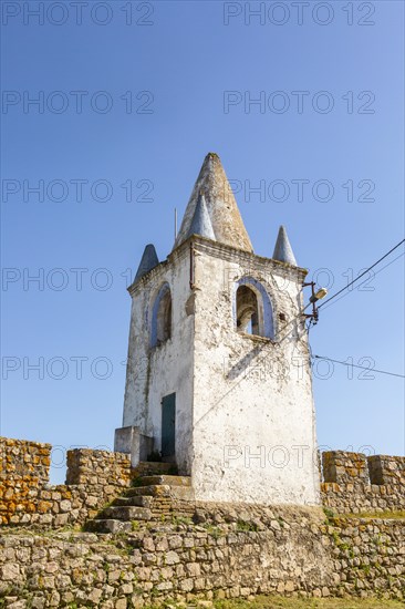 Battlements stone ramparts and watch tower in historic castle ruins at Arraiolos, Alentejo, Portugal, southern Europe, also known as Paco dos Alcaides built in 14th century, Europe