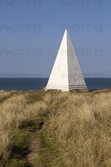 Emmanuel Head white pyramidal navigation beacon, Holy Island, Northumberland, England, UK built 1801-10 by Trinity House