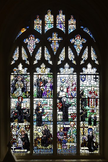 Stained glass window of saints, Bauchon chapel of Our Lady of Pity, Norwich Cathedral, Norfolk, England, UK