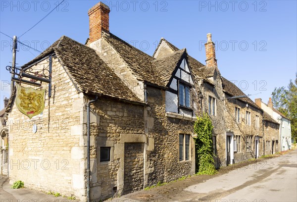 Historic former Red Lion pub in Melksham, Wiltshire, England, UK row cottages Cotswold stone