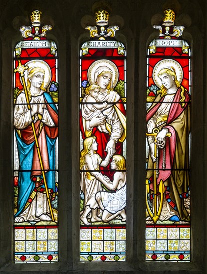 Stained glass window Faith, Charity, Hope church of Saint Swithin, Combe, Berkshire, England, UK 1881 by Gibbs and Howard