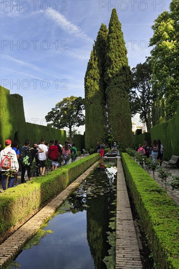 Tourists, Strollers in gardens with water basin, Generalife Gardens, Alhambra, UNESCO World Heritage Site, Granada, Spain, Europe