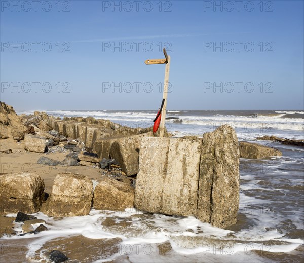 March 20 2018 Hemsby, UK. Coast path sign left abandoned by coastal erosion at Hemsby, Norfolk, England, UK