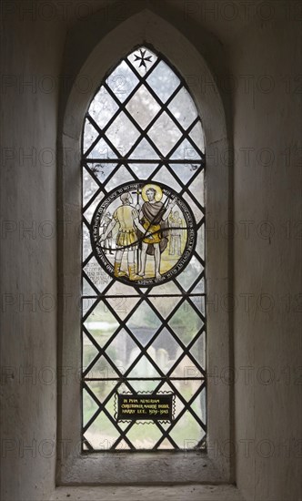 Church of John the Baptist, Barnby, Suffolk, England, UK stained glass roundel window by Margaret Edith Aldrich Rope Saint John the Baptist and Roman soldier