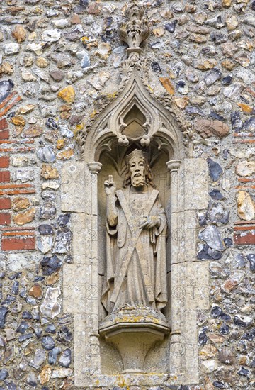 Stone statue of Saint Andrew church of Ilketshall St Andrew, Suffolk, England, UK
