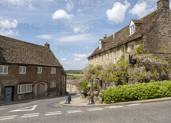 Historic stone buildings in village of Norton St Philip, Somerset, England, UK