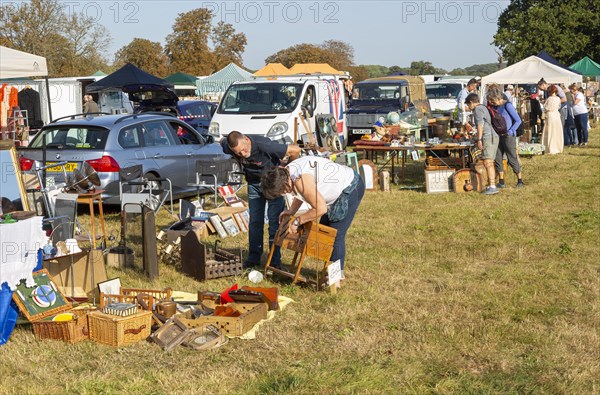 People browsing items on sale Glemham Hall, Suffolk, England, UK Grand Brocante vintage antique event September 2019