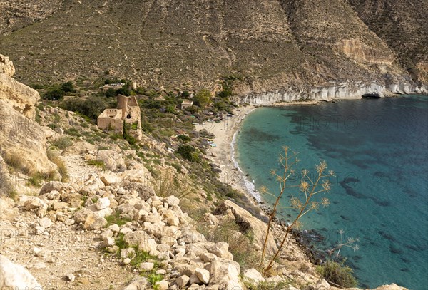 Castle, buildings and beach Cala de San Pedro, Cabo de Gata Natural Park, Nijar, Almeria, Spain, Europe