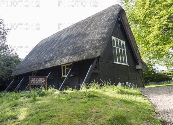 Thatched wooden church of St Mary and St Nicholas village parish church, Sandy Lane, Wiltshire, England, UK