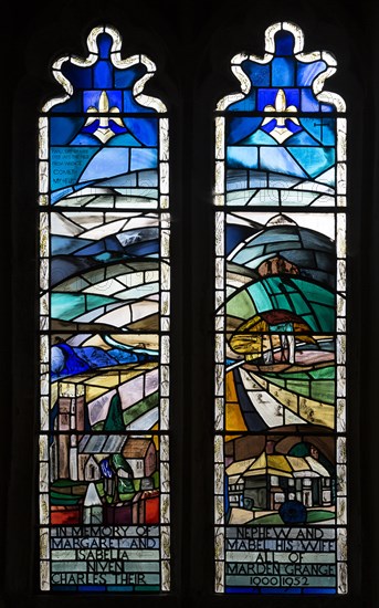 Modern stained glass window in church of Saints Peter and Paul, Marden, Wiltshire, England, UK by Molly Kettlewell 1979 showing landscape Vale of Pewsey chalk downs