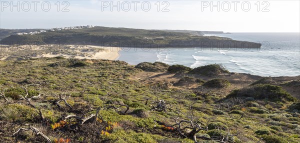 Panorama view of river mouth of Ribeira de Aljezur reaching the Atlantic Ocean and whitewashed buildings of Clero village, Aljezur, Algarve, Portugal, Southern Europe, Europe