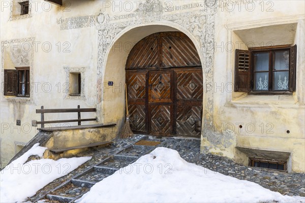 House entrance door, window, historic house, sgraffito, facade decorations, Guarda, Engadin, Grisons, Switzerland, Europe