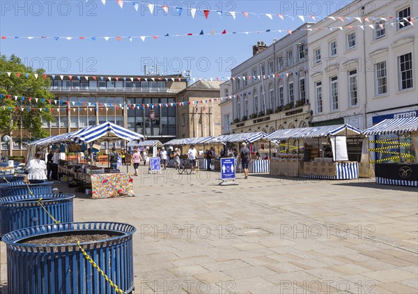 As lockdown eases a small number of shoppers and few stallholders attend the open air market, Warwick, Warwickshire, England, UK 30th May 2020