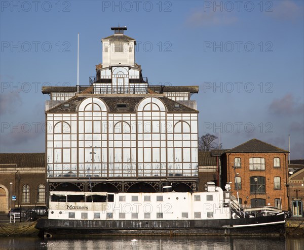 Modern glass office building and Mariners floating restaurant boat, Ipswich Wet Dock, Suffolk, England, Uk