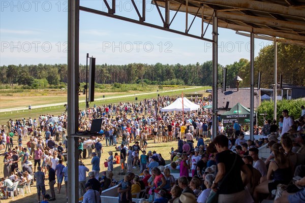 Race day at the racecourse in Hassloch, Palatinate. An estimated 3, 000 to 4, 000 spectators were present in beautiful summer weather and not too hot temperatures