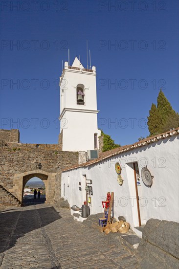 Whitewashed tower and gateway to historic walled hilltop village Monsaraz, Alto Alentejo, Portugal, southern Europe, Europe