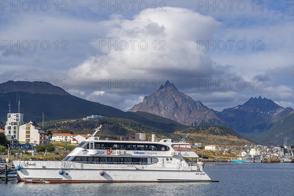 Excursion boat in the harbour on the Beagle Channel at the foot of the mountains, Ushuaia, Tierra del Fuego Island, Patagonia, Argentina, South America