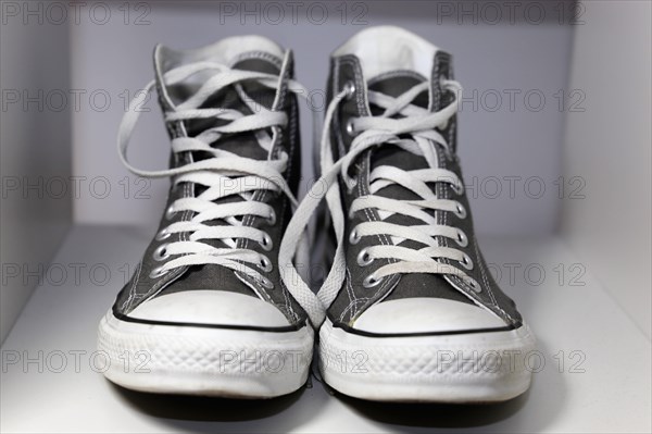 Grey Chucks on a shelf