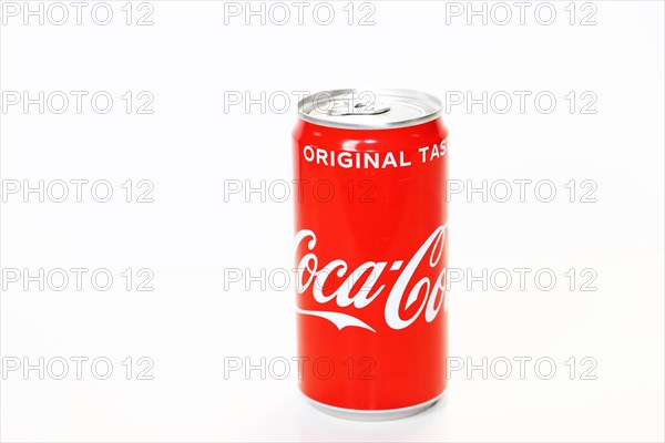 Coca-Cola can in front of a white background